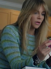 Back design of blue green striped sweater from High Potential