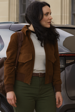 Side view of Rachel Brosnahan Superman 2025 brown suede leather jacket with shirt collar and flap pockets