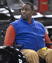 Stylish blue vest side profile worn by Daryl Mitchell in Shifting Gears