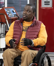 Stylish maroon puffer vest side profile worn by Daryl Mitchell in Shifting Gears