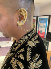 Detailed embroidery close up on men’s handcrafted black velvet blazer