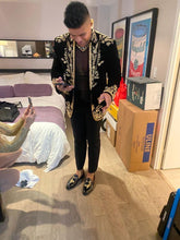 Full body look of men’s black velvet embroidered tuxedo blazer for parties