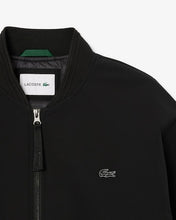 Men’s Quilted Water Repellent Stretch Bomber Jacket close up chest logo
