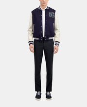Back view of navy blue teddy jacket with patch