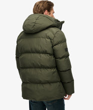 Olive green padded puffer jacket closeup men’s long warm winter coat